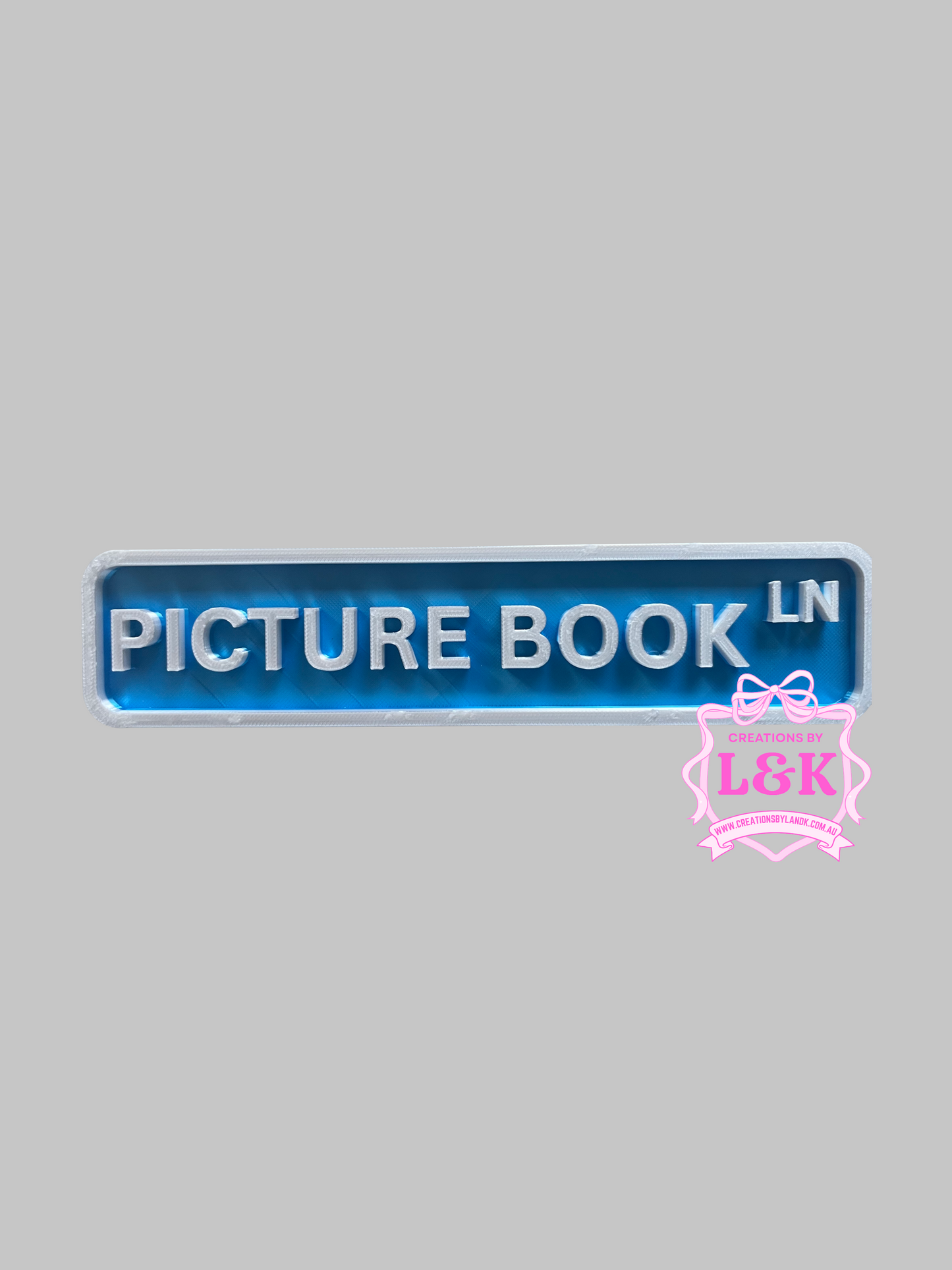 Picture Book Ln - Shelf Sitting Street Sign